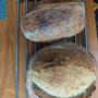 Both loaves from exactly the same batch, one cooked in a dutch oven, one next to it in the normal oven