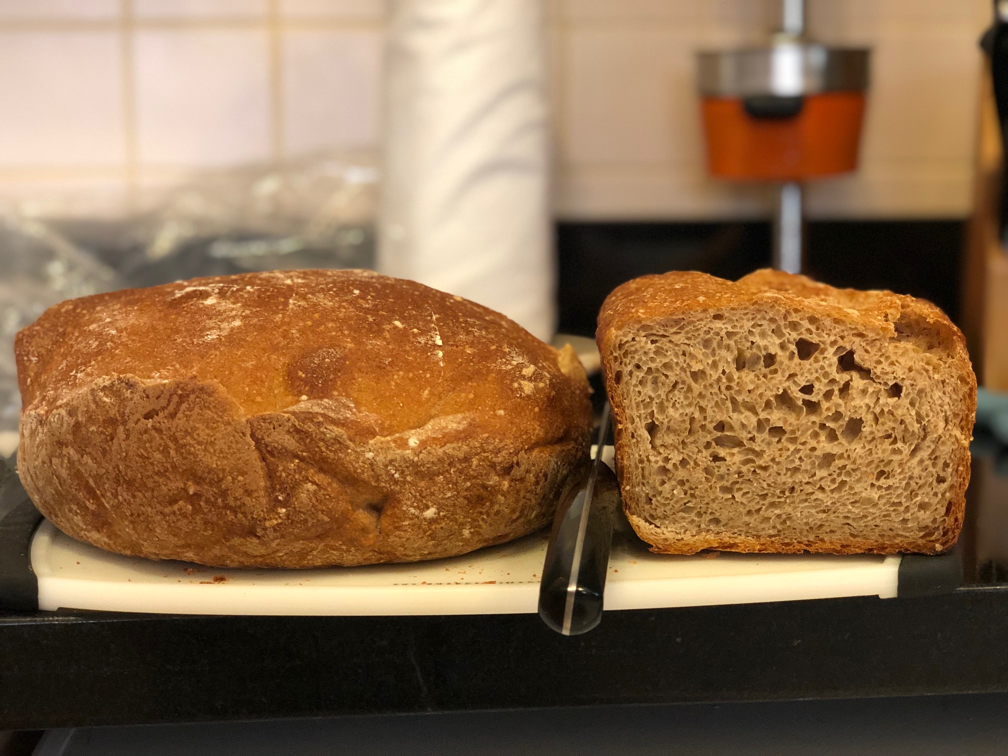 The dutch oven loaf rose better.  Denser crumb on the bottom. 