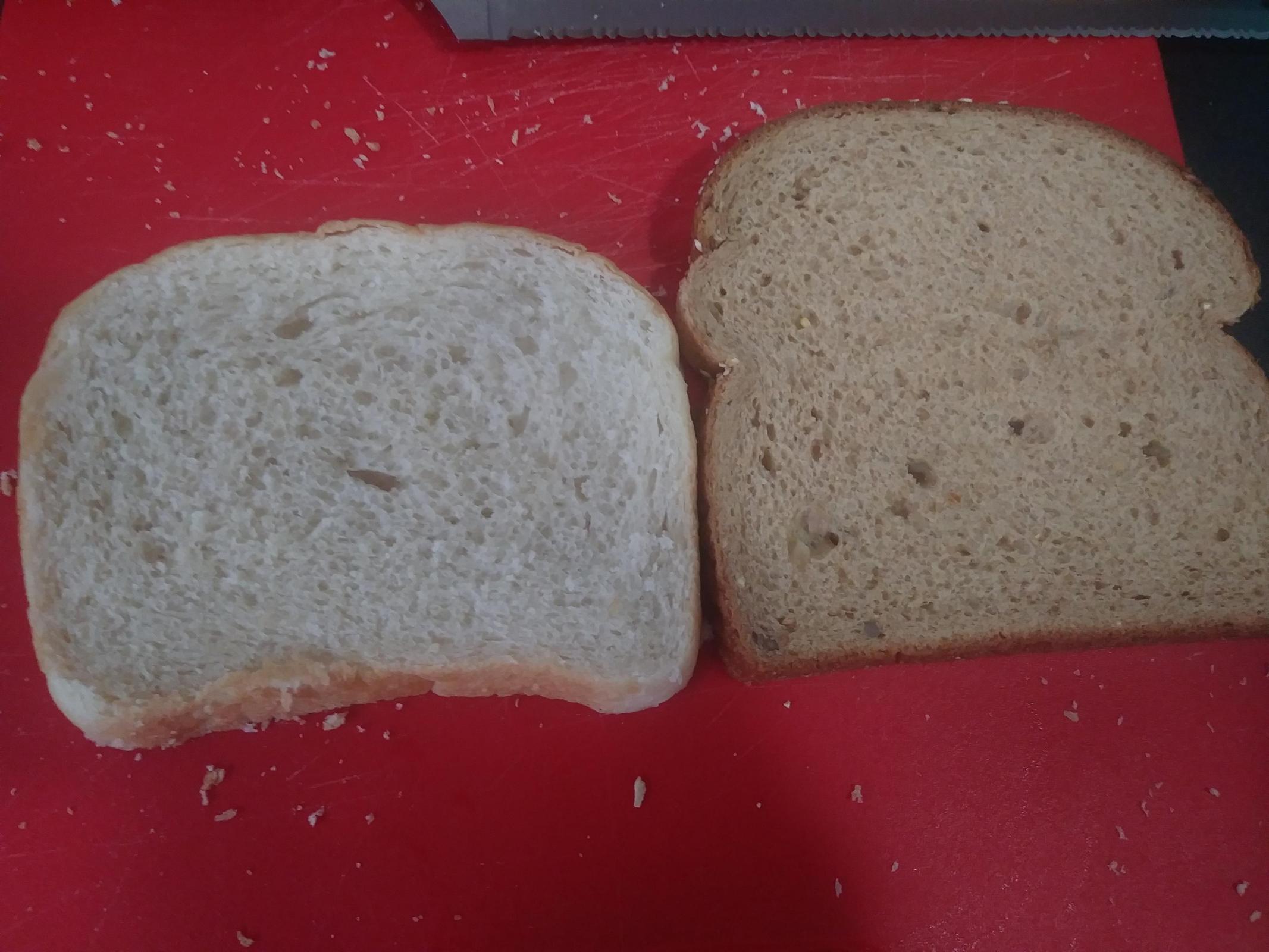 Side by side. My white loaf on the left, store bought multi-grain on the right.