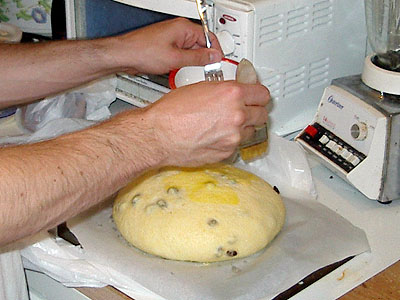 sweet corn raisin bread being glazed