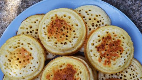 A top down view of a plate of crumpets