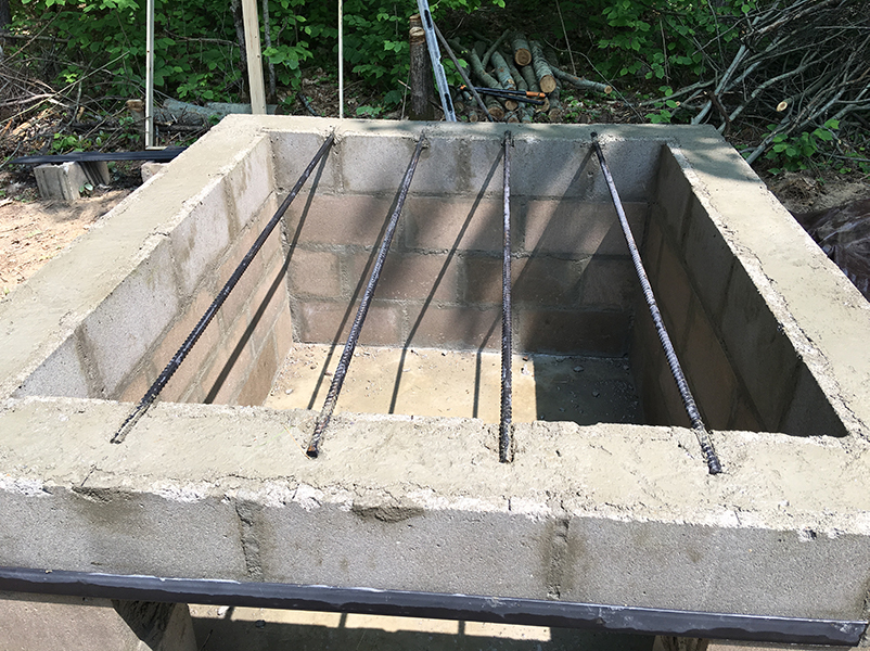 I set the rebar flush with the top of the wall, but pulled it out before the concrete set completely