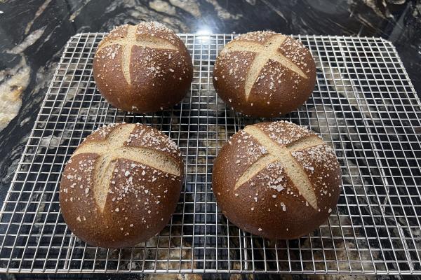 Pretzel rolls on cooling rack